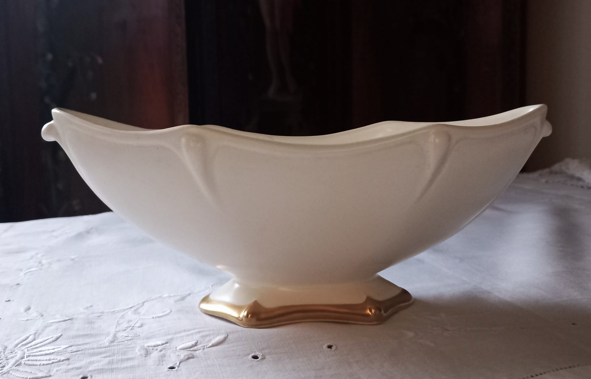 Close-up of Royal Winton Grimwades mantle vase showing sculpted Art Deco style moulding and gold gilt foot detail