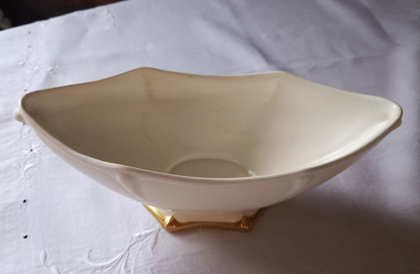 Close-up of Royal Winton Grimwades mantle vase showing sculpted Art Deco style moulding and gold gilt foot detail