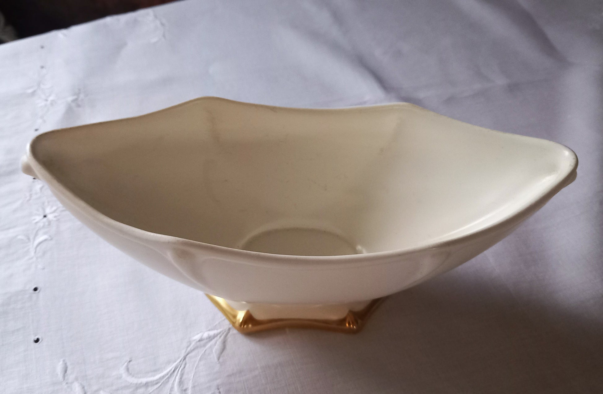 Close-up of Royal Winton Grimwades mantle vase showing sculpted Art Deco style moulding and gold gilt foot detail