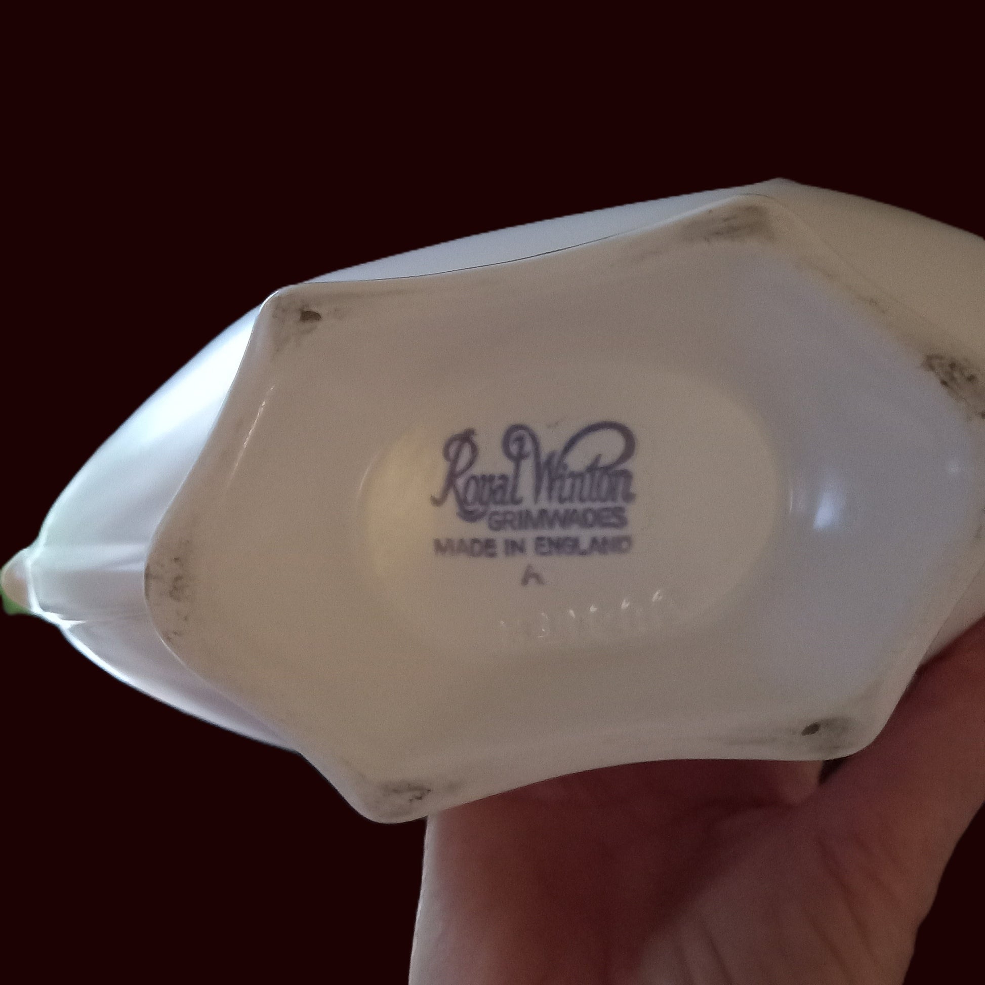 Base of Royal Winton Grimwades mantle vase showing Made in England backstamp, ivory glazed earthenware with age patina