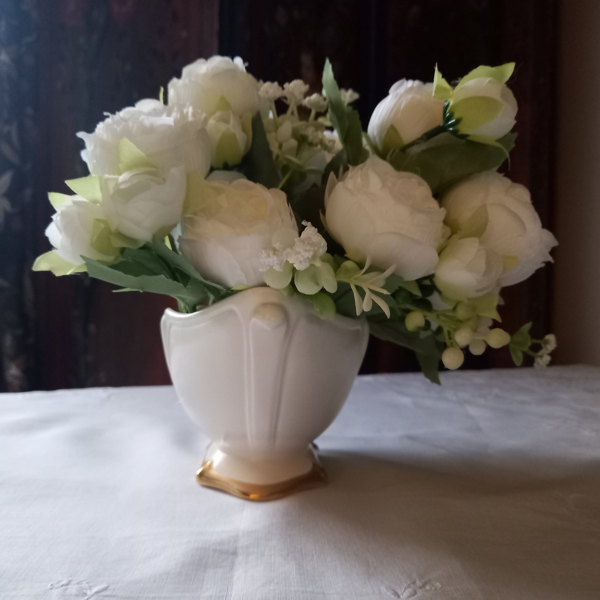Footed Royal Winton mantle vase in soft ivory glaze, gently scalloped sides with gold base, styled with classic white flowers