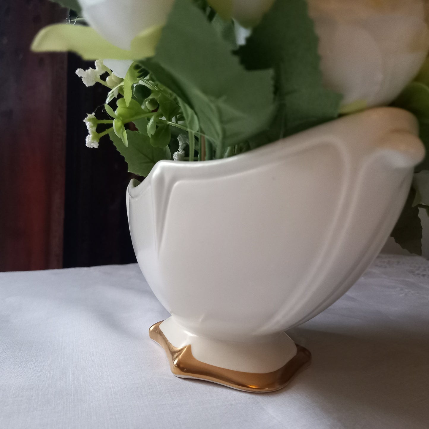 Footed Royal Winton mantle vase in soft ivory glaze, gently scalloped sides with gold base, styled with classic white flowers