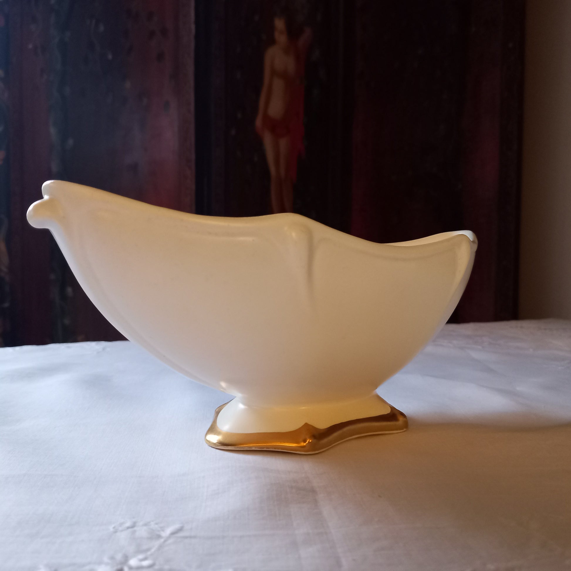 Footed Royal Winton mantle vase in soft ivory glaze, gently scalloped sides with gold base