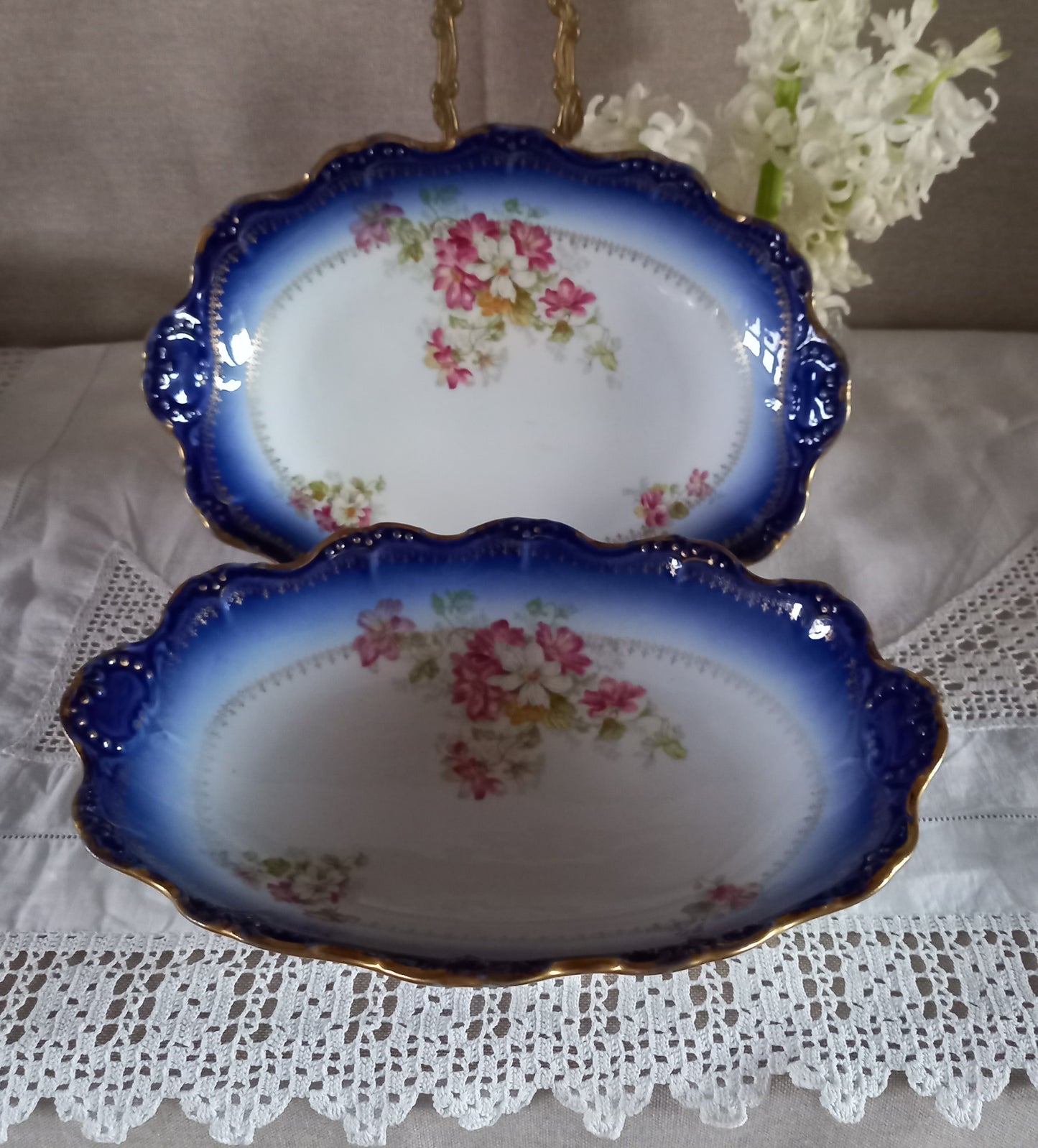 Antique French Limoges oval serving dishes, cobalt blue fade with gilt rims and floral design