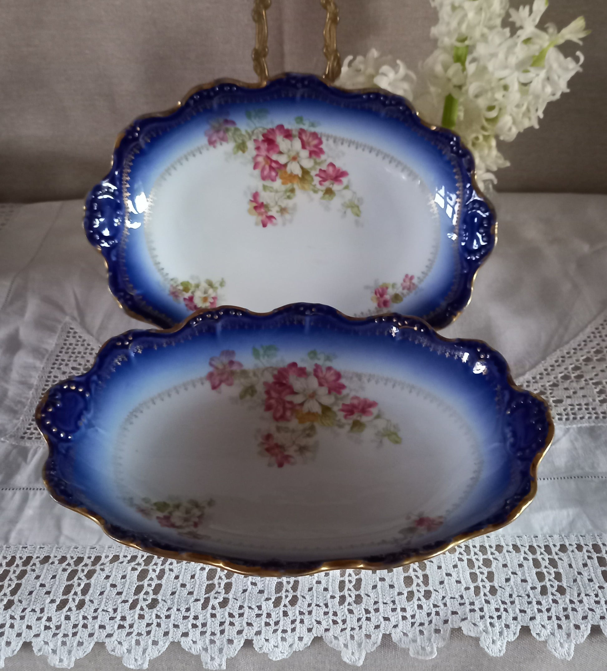 Antique French Limoges oval serving dishes, cobalt blue fade with gilt rims and floral design