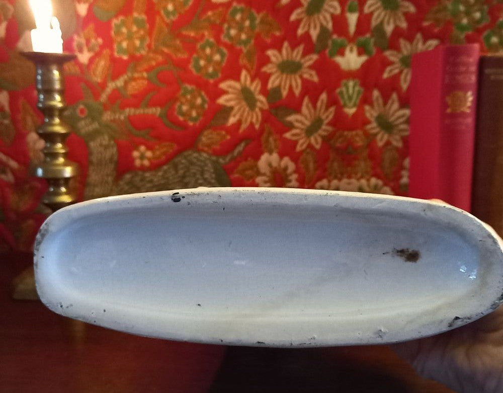 Victorian Staffordshire flatback clock group mantel ornament in glazed earthenware, circa 1850–1875, styled on dark wood library mantel with brass candlestick and antique books base shown